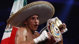 Mexico's Estrada celebrates after beating Viloria of the U.S. during their WBO/WBA World Flyweight Title match at Cotai Arena